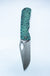 Dixon folding pocket knife with a rock textured teal handle shown open against a plain white background