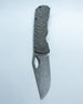 A Dixon folding pocket knife with a rock textured dark gray handle and matching blade shown on white background.