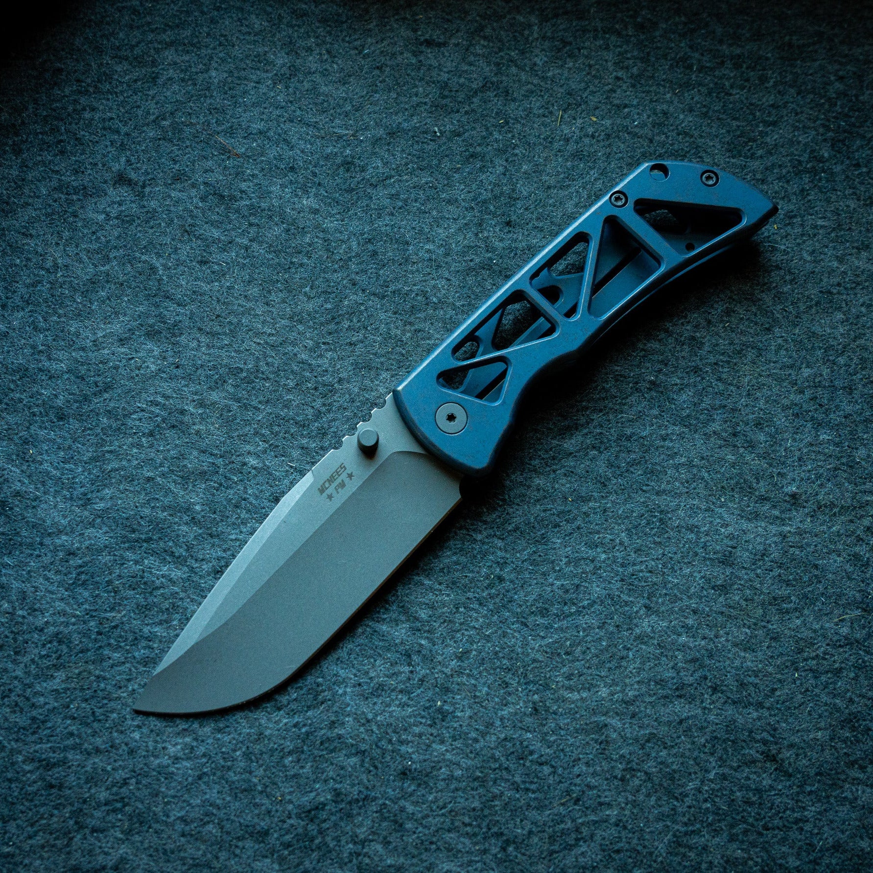 PM Mac 2 3.5" Skelly - a skeletonized version of the folding pocket knife with blue handle
